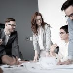 MarQi Co. team reviewing commercial real estate project plans